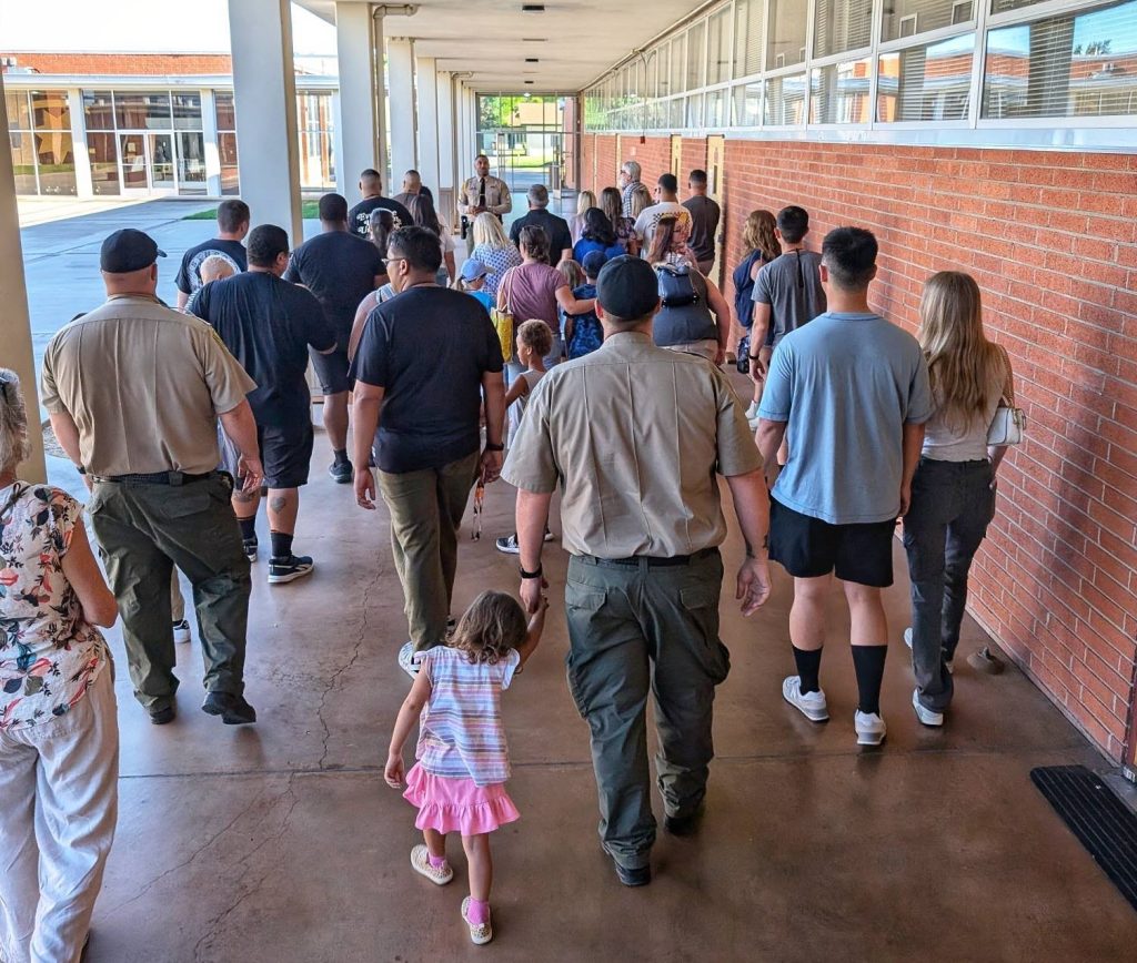 Cadets and their families tour the academy.