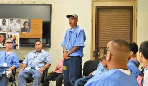 Diversion program at Mule Creek State Prison with incarcerated people speaking to at-risk youth.