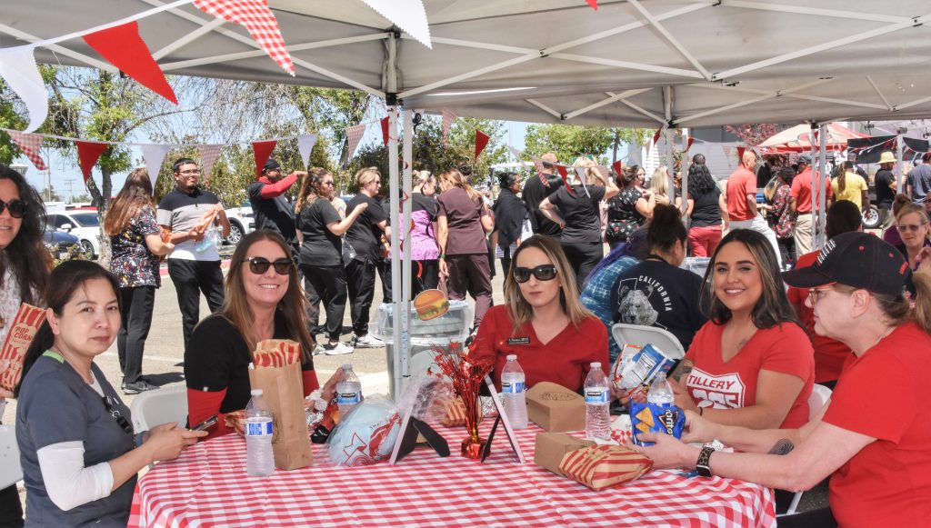 Prison employees sit at a table for a luncheon.