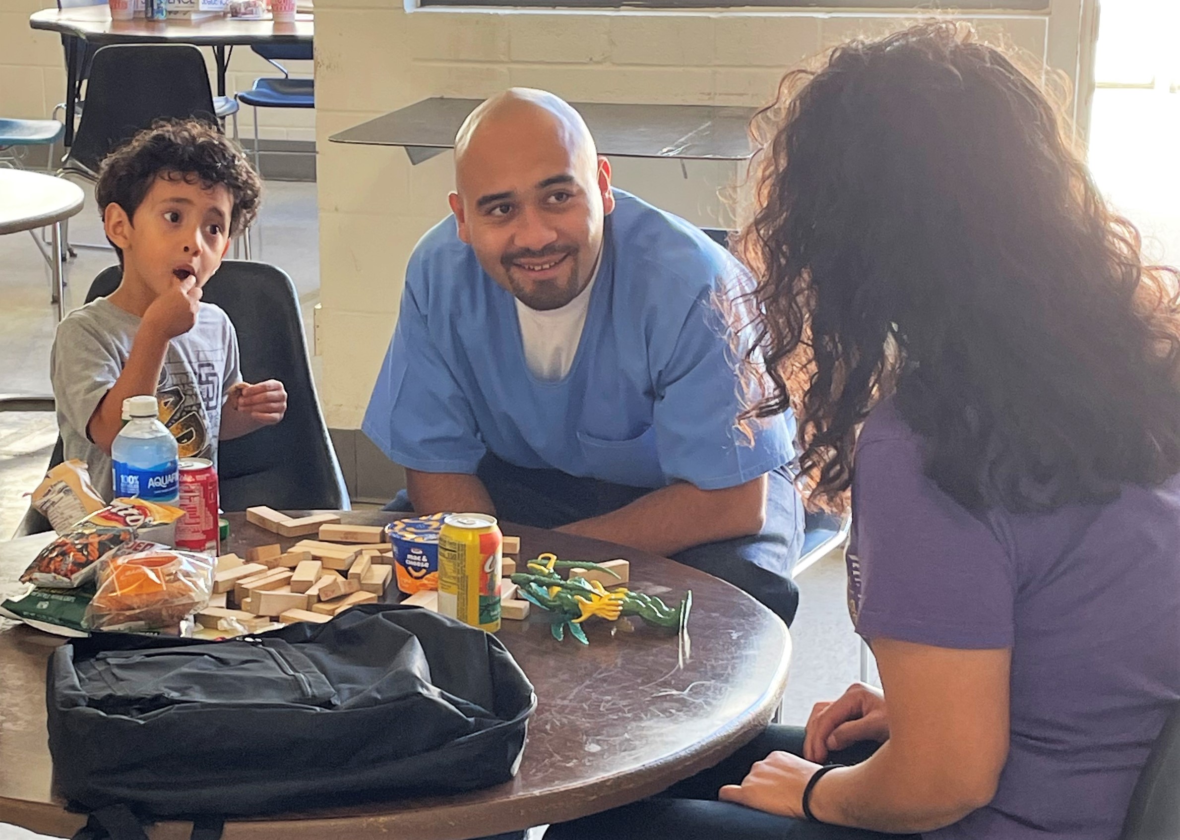 Incarcerated parents give backpacks to their children thanks to staff and a community nonprofit in San Diego.