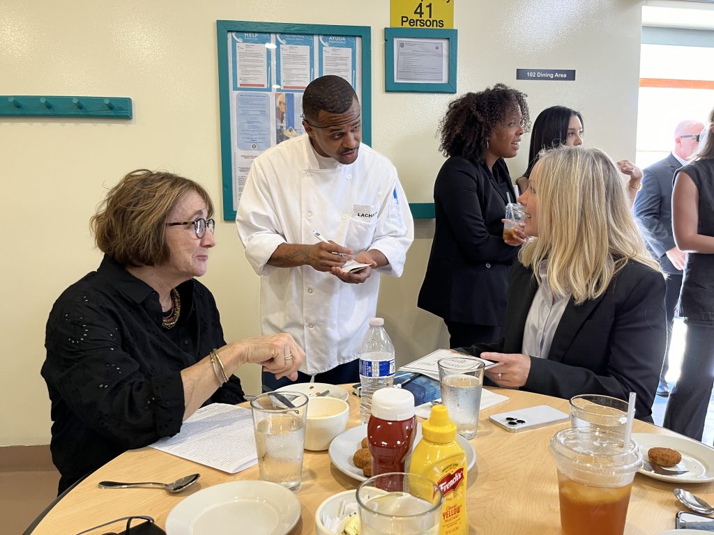 A man waits a table at the restaurant.