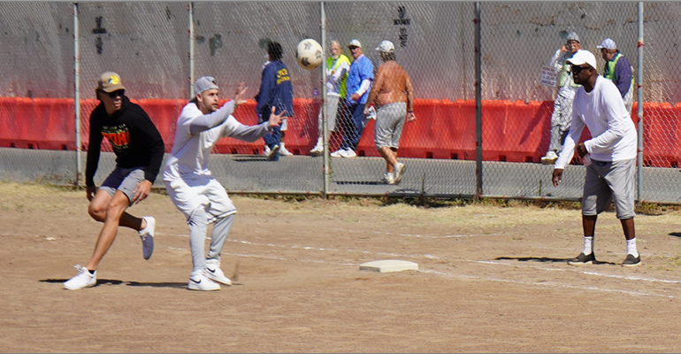 Players on a field for kickball.