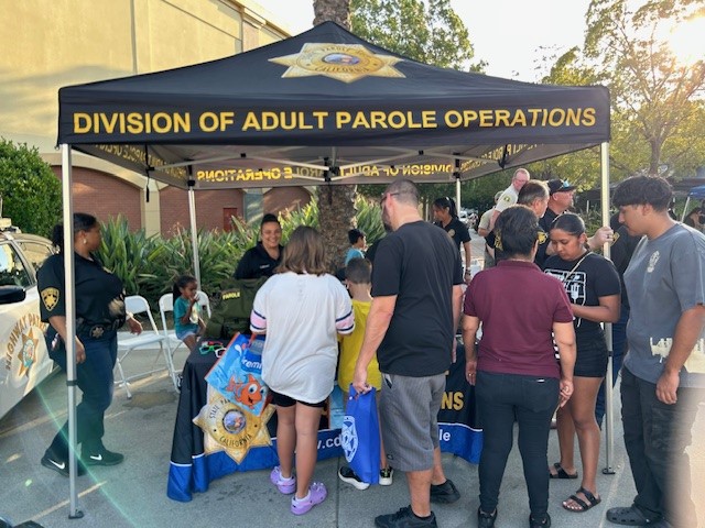 Parole agents at a booth in Rancho Cucamonga for National Night Out.