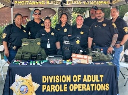 Agents at a booth for the Division of Adult Parole Operations.