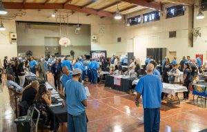 Reentry fair held in the gymnasium at a prison.