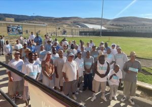 A group prepare to walk the track at California Men's Colony.