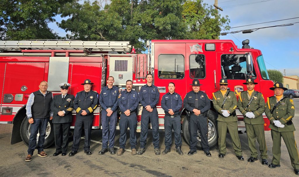 Fire engine with city staff and prison personnel.
