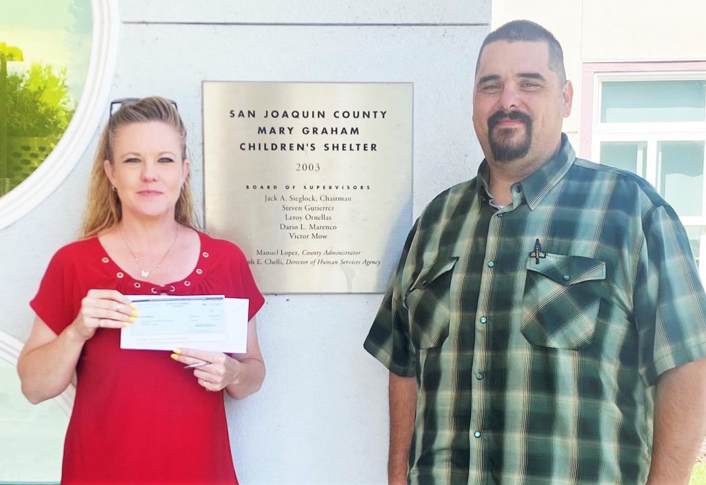 A children's shelter receives a check from Mule Creek State Prison.