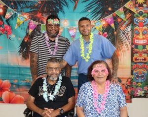A family visiting their incarcerated loved one at Mule Creek State Prison on Labor Day weekend for a luau themed event.
