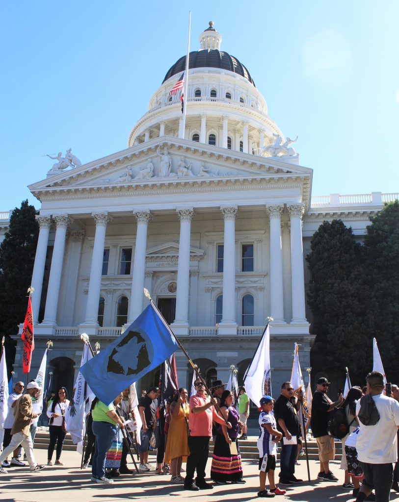 Tribal flags in front of the state Capitol.