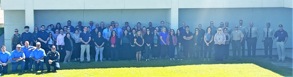 Group photo of incarcerated firefighters and staff at Pleasant Valley State Prison.