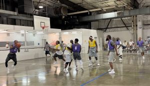 Intramural basketball game at RJD with incarcerated people playing the game in a gymnasium.