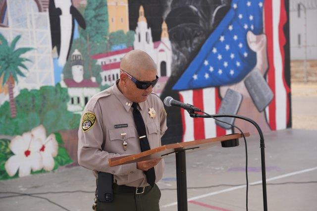 A staff member speaks during one of the events to honor lives lost during the terror attacks on Sept. 11, 2001.