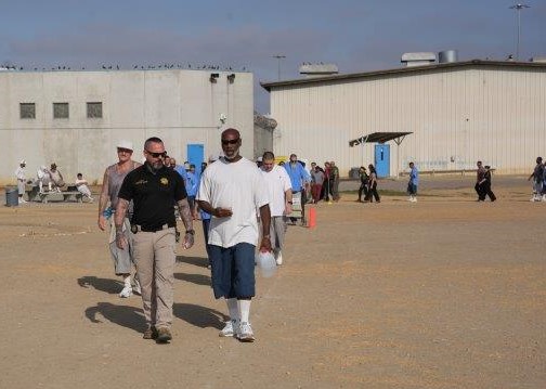 Staff and the incarcerated population walking laps at RJD Correctional Facility in San Diego, California.