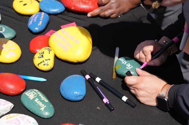 Rocks painted with messages of hope.