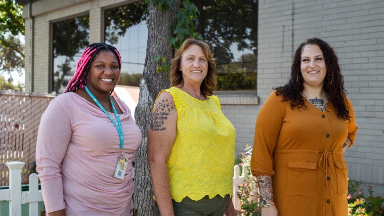 three women standing together