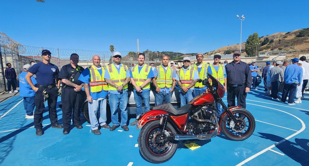 A red Harley motorcycle at San Quentin for Mental Wellness Week.