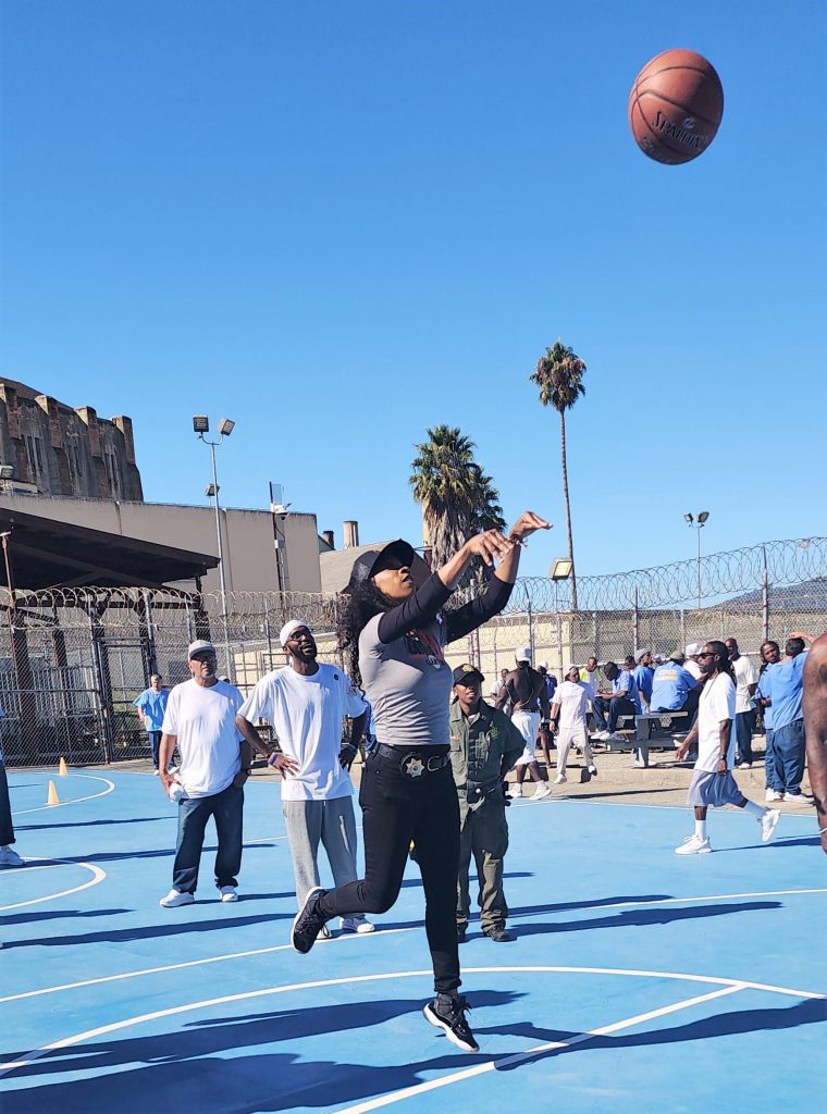 San Quentin sergeant with a basketball. 