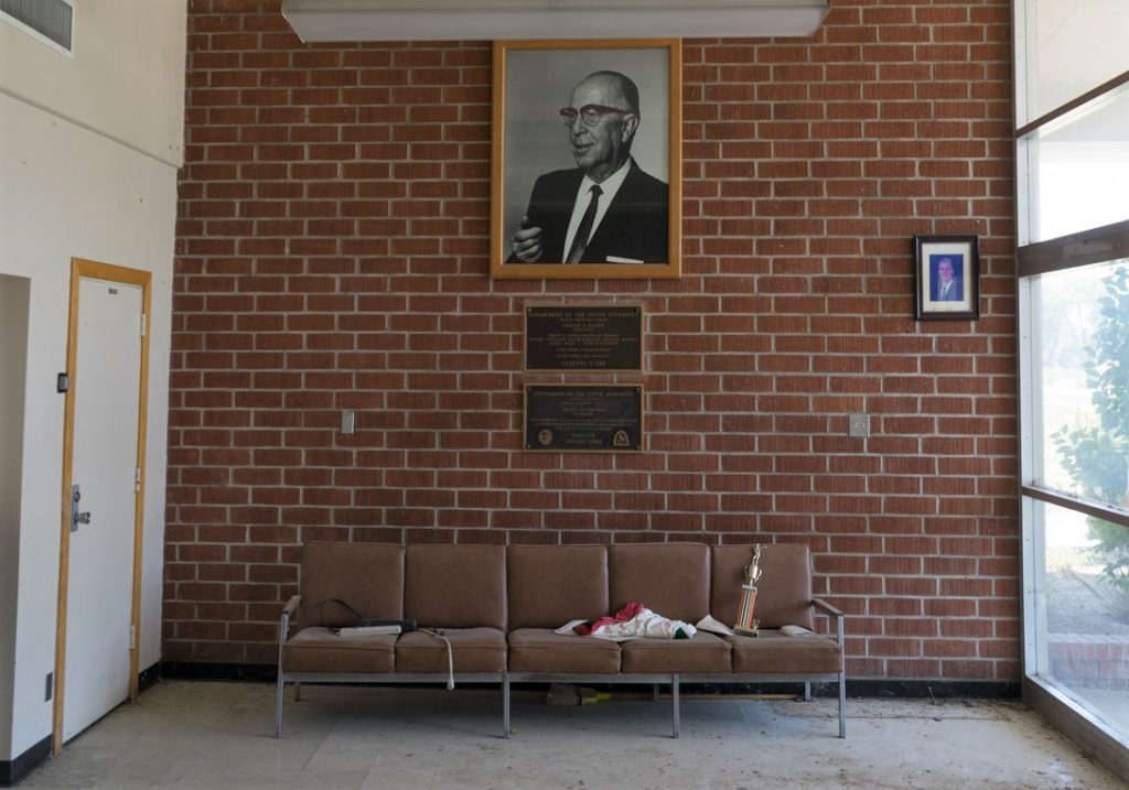 A photo taken by David Reeve showing a trophy on a couch, won by Tony Espinosa in 1987 at Heman G Stark Youth Correctional Facility.