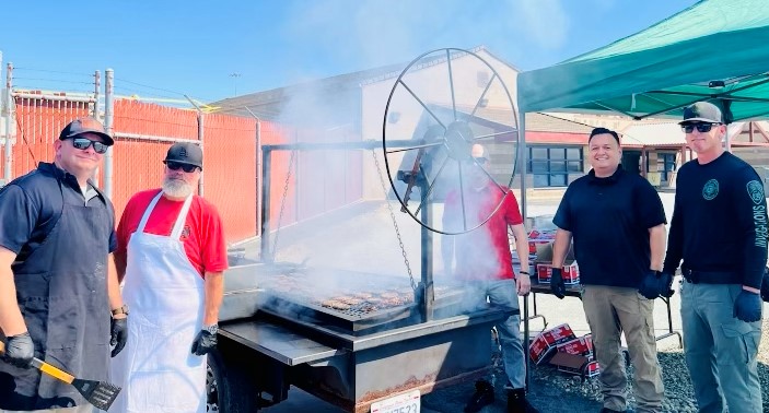 Staff working the grill at Valley State Prison.