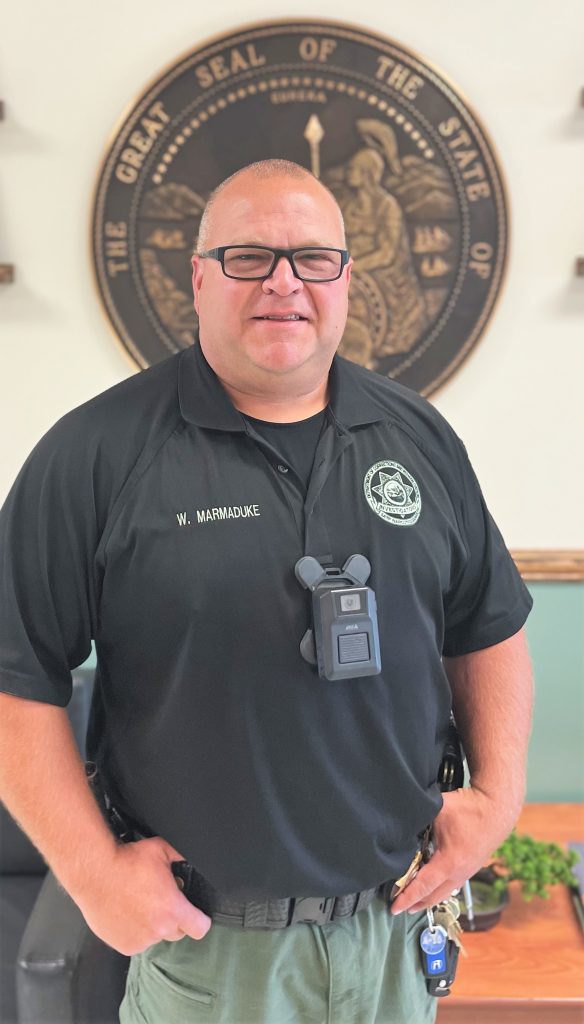 Correctional Officer Will Marmaduke standing in the lobby of a prison.