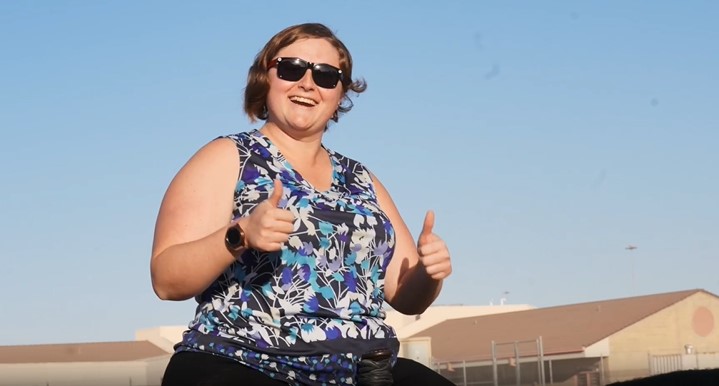 Library assistant on a horse.
