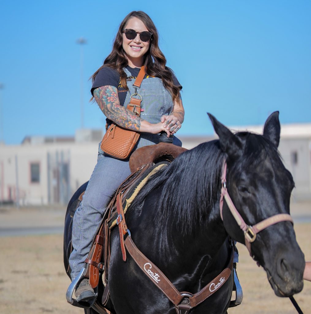 A woman rides a horse at CCWF.