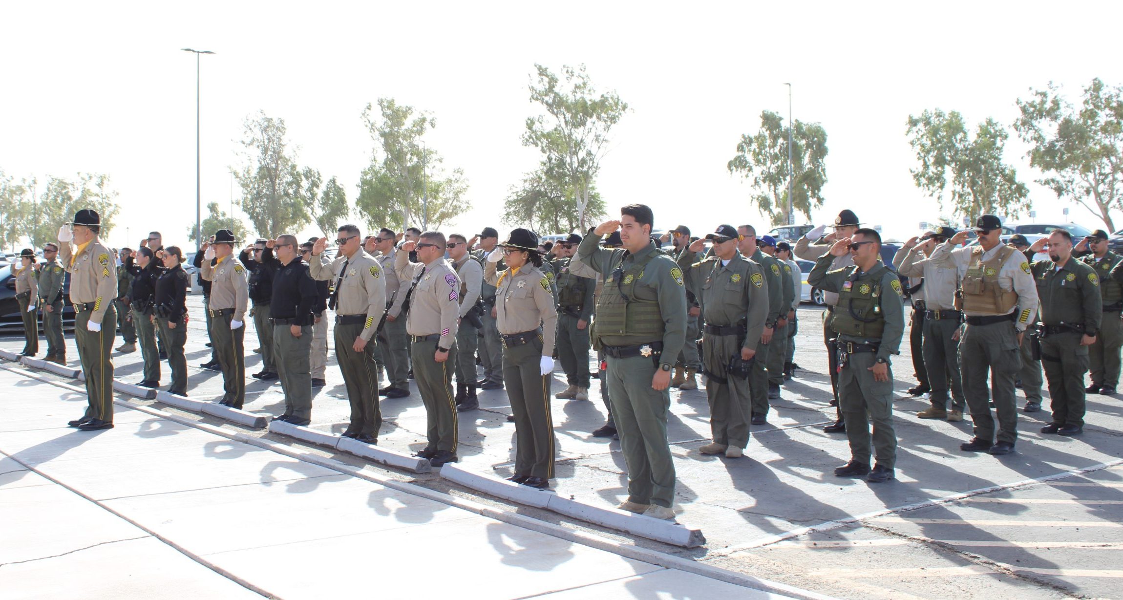 Centinela correctional officers salute during the flag ceremony.