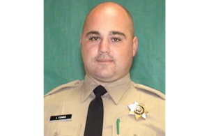 Jeremy Combs wearing his correctional officer uniform obituary image.