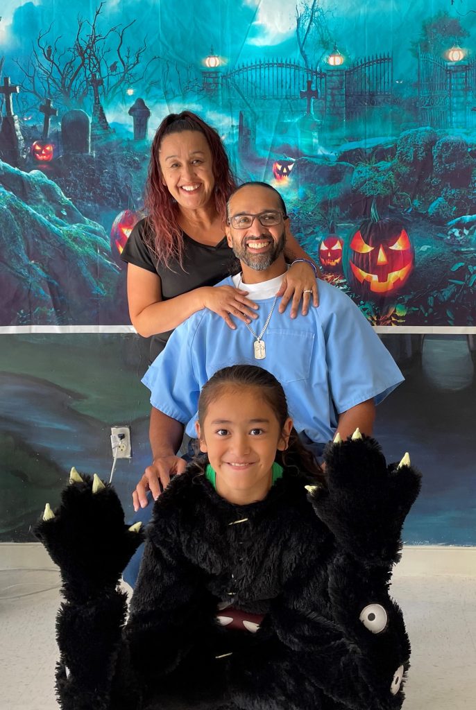 Family photos with Halloween backgrounds at Ironwood State Prison.