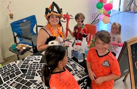 Woman makes shaved ice for kids.