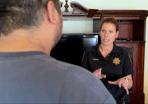 CDCR Parole Agency Tracy Master speaking with someone as part of Halloween safety program called Operation Boo.