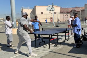 At SATF, incarcerated people play ping pong during A Day of Abilities.