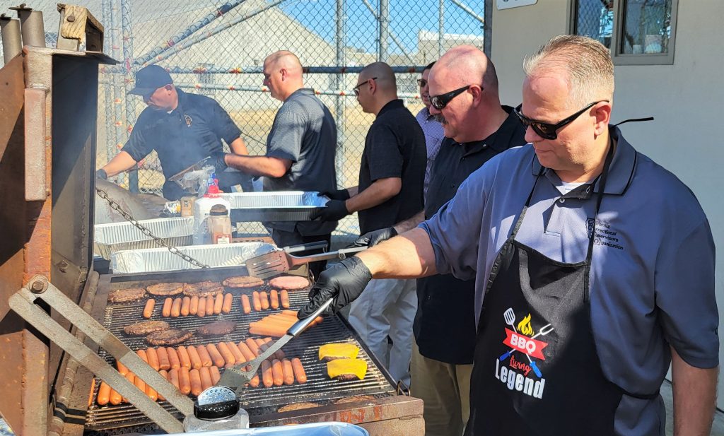 Management grills burgers and hotdogs for staff during a Solano appreciation event. 