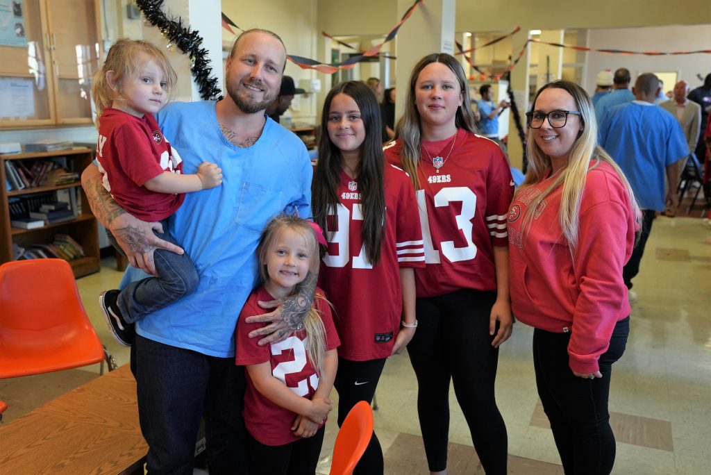 Inspire Change initiative from San Francisco 49ers with an incarcerated person and his family members.