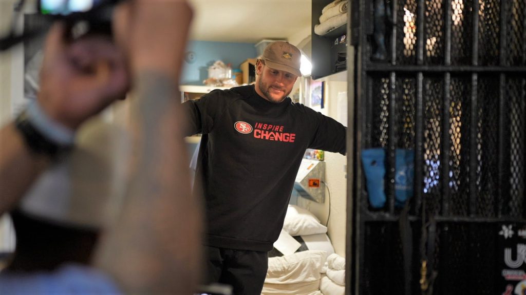A 49ers representative looks at a cell in San Quentin.