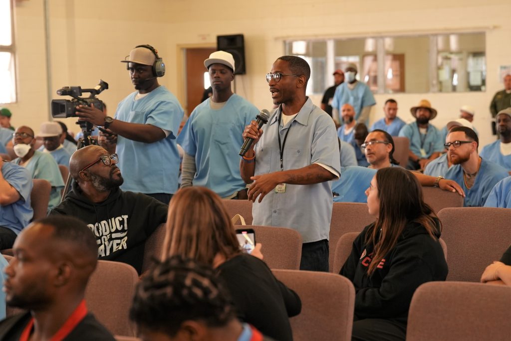 Incarcerated people speak with the team chaplain and San Francisco 49ers about rehabiltitation.