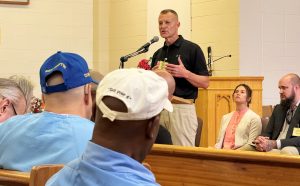 An Army colonel from the Veterans Justice Commission speaks to incarcerated people at San Quentin.