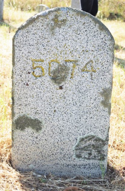 Folsom State Prison grave marker with 5074 etched into stone.