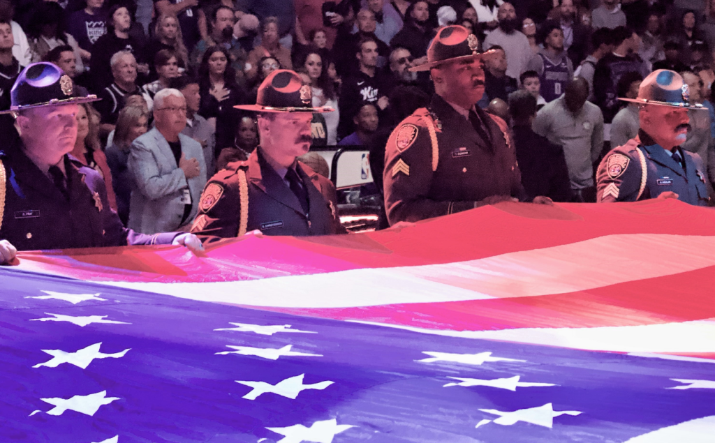 Recruitment staff holding American flag