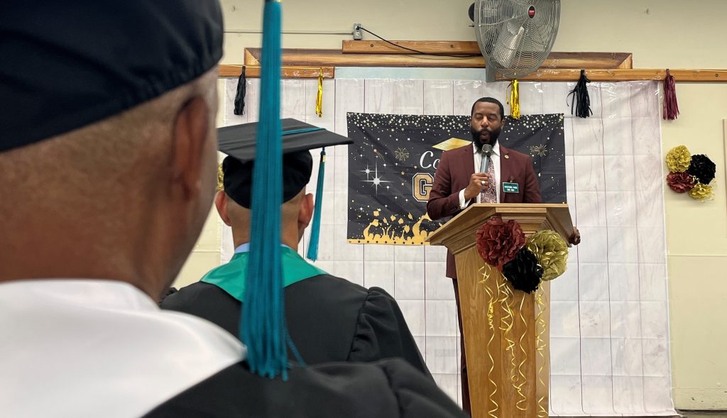 Guest speaker at the CMC graduation with family members attending for the first time.