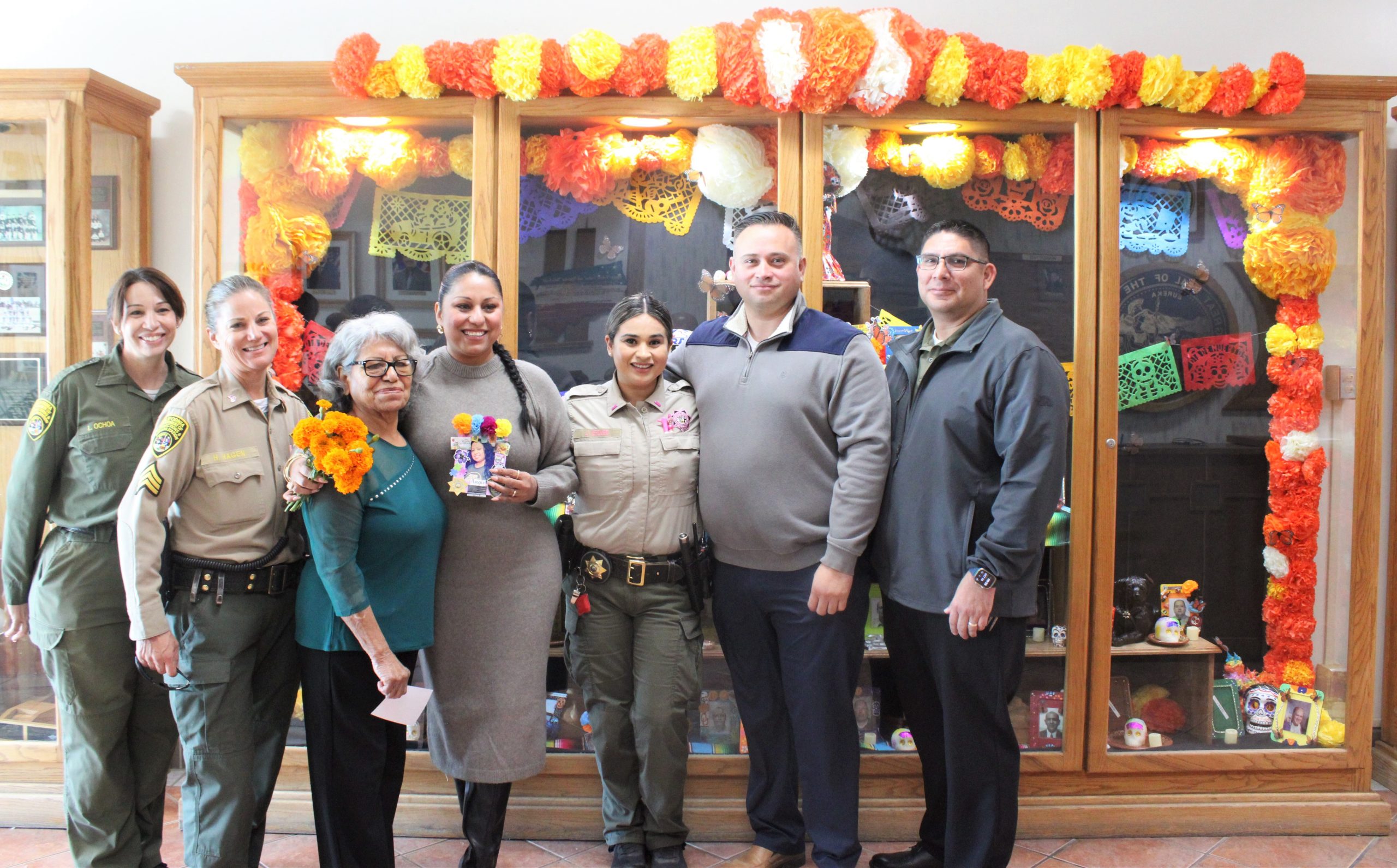 Dia de los Muertos display with staff standing in front at Centinela.