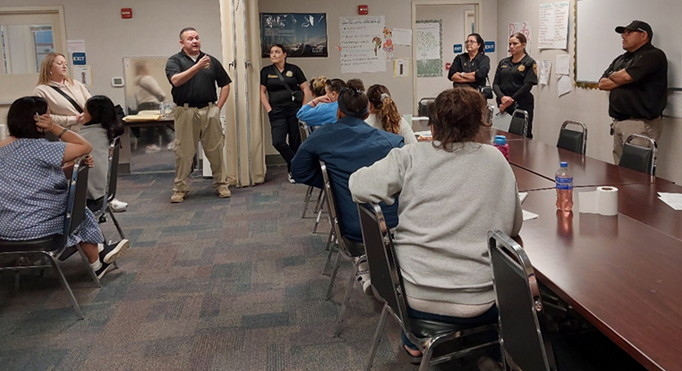 staff from DAPO speaking at CIW