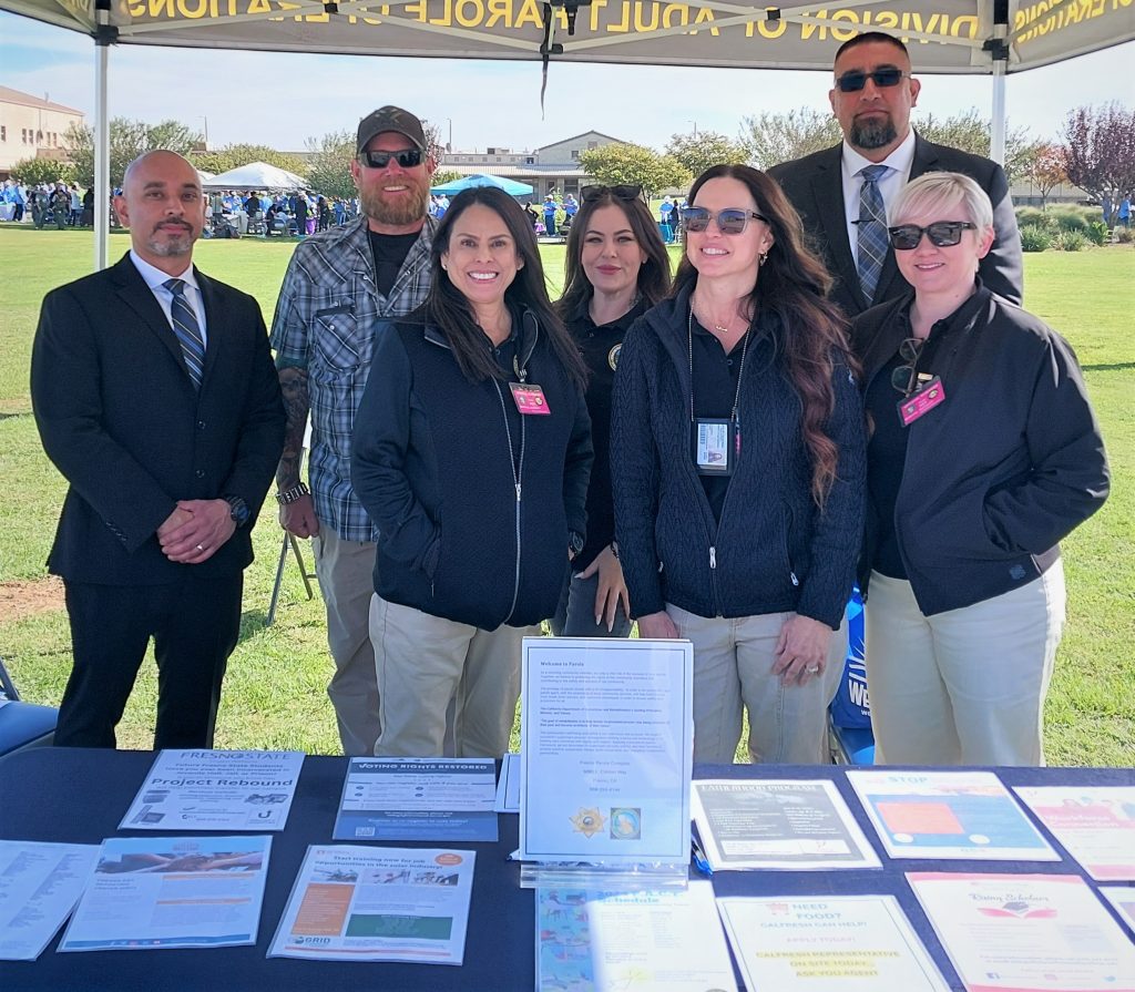 parole staff standing at booth