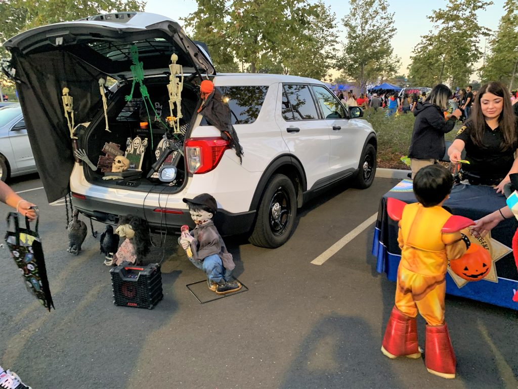 Capitol District parole with a decorated vehicle for a Halloween trunk-or-treat event.