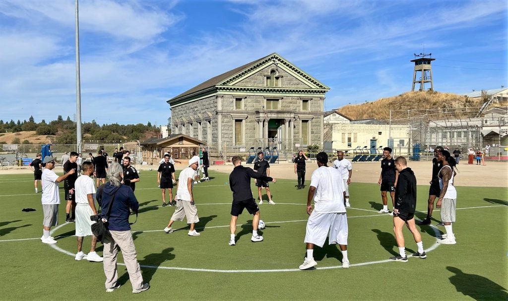 Players run drills for at Folsom State Prison.