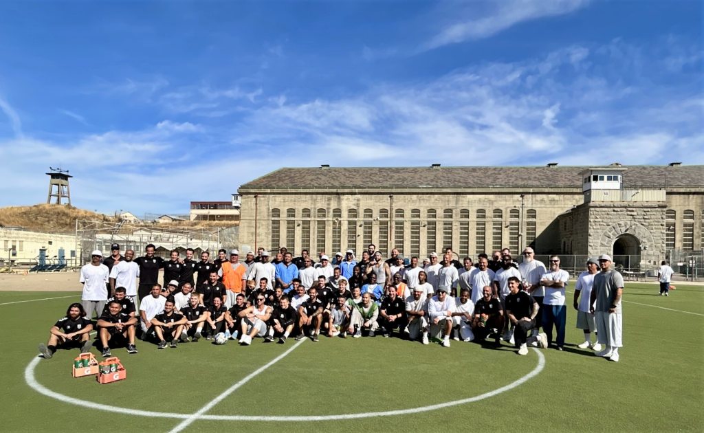 Group photo of incarcerated soccer players and the Sacramento Republic team.