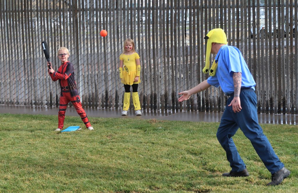 High Desert State Prison visiting event for Halloween and Dia de los Muertos (Day of the Dead) shows children playing with their incarcerated parent. 