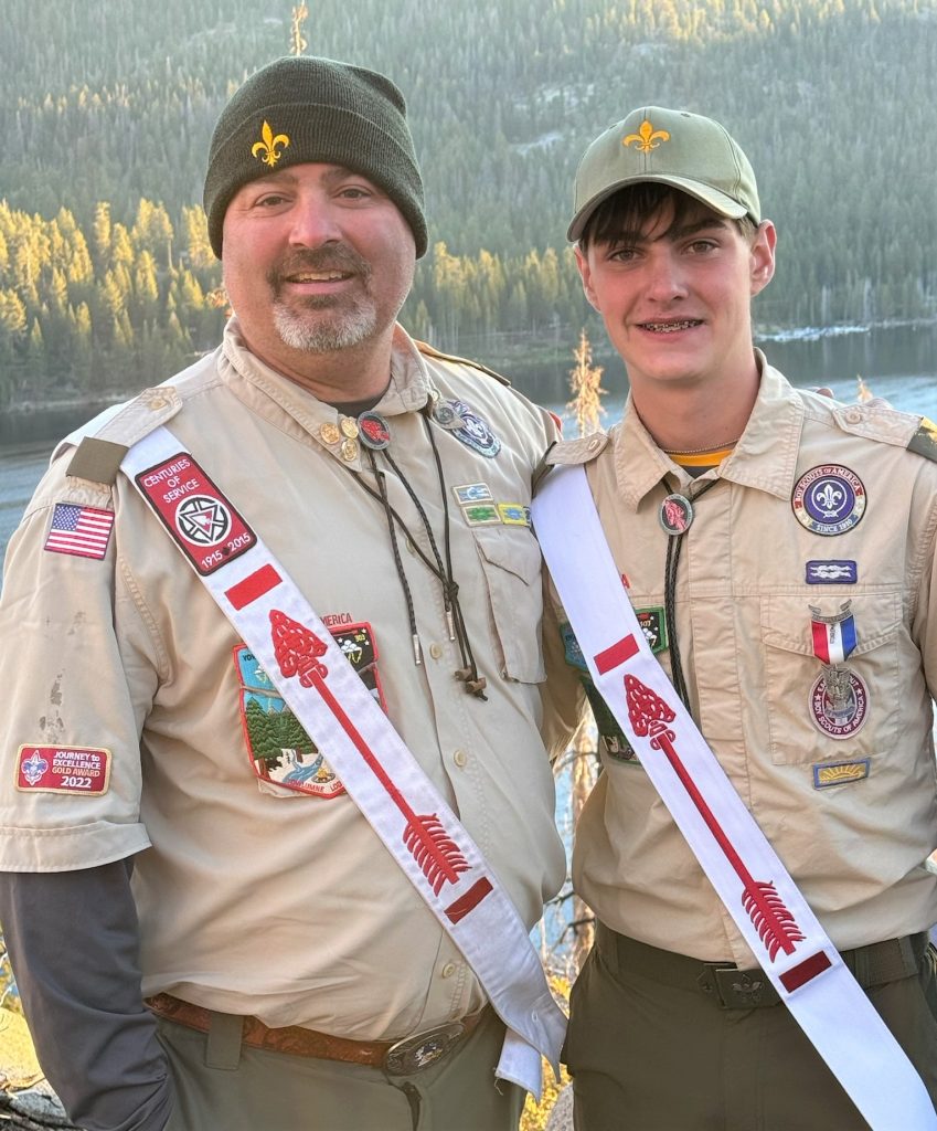 Hoffman and son in front of mountains