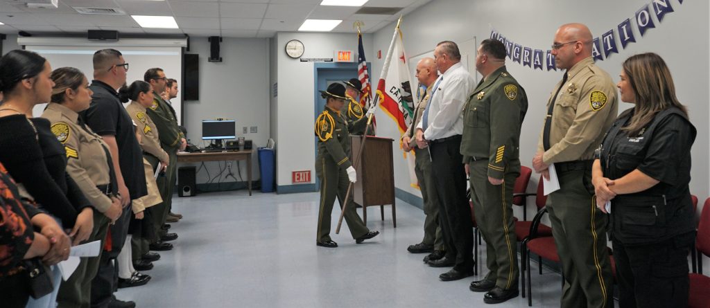 Honor guard presenting colors at the prison ceremony.